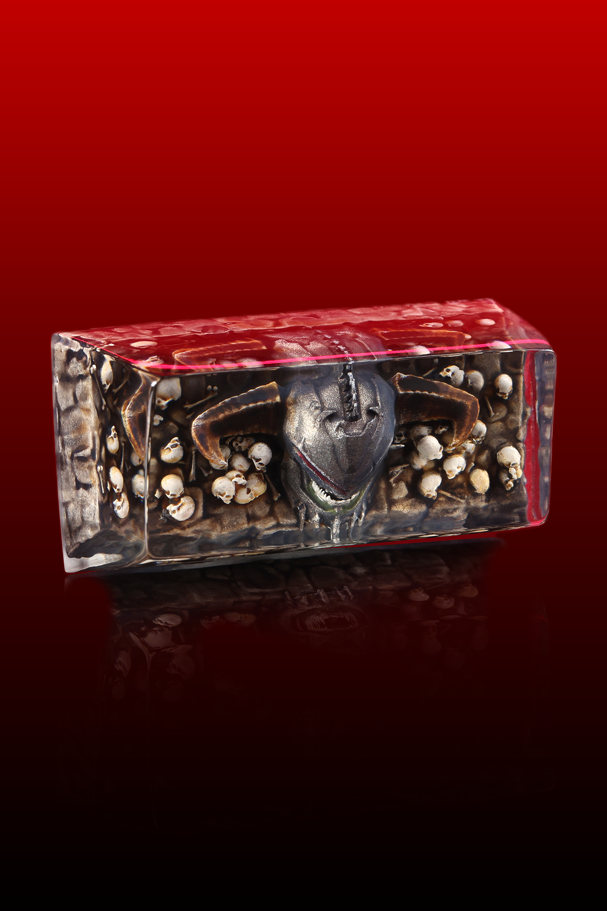 Decorative box with a face design on a red background