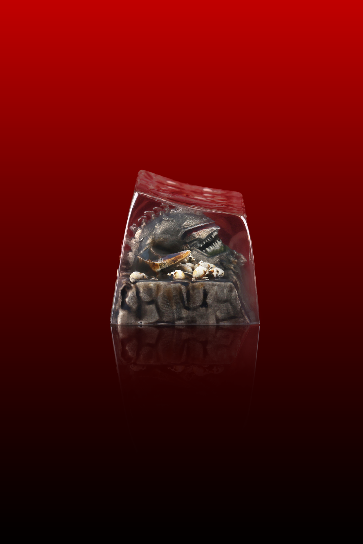 Small figurine or sculpture in a clear bag on a red background