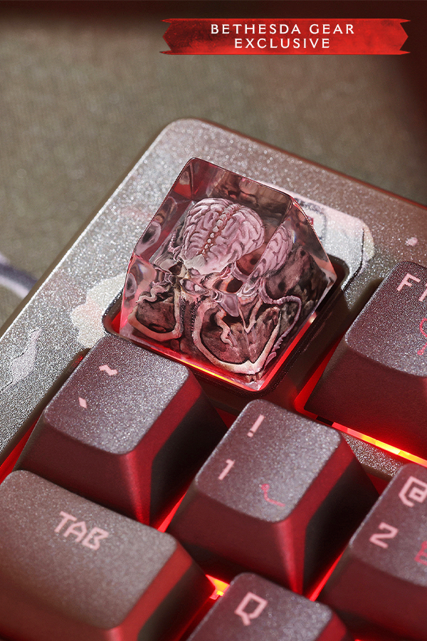 Close-up of a keyboard with a transparent key featuring a brain design, labeled 'Bethesda Gear Exclusive'.