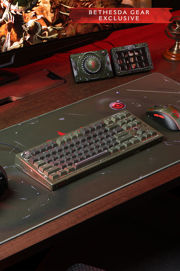 Gaming setup with keyboard, mouse, and monitor on a desk, featuring Bethesda Gear branding.