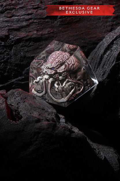 Diamond-shaped object with a brain and tentacle design on a dark background, labeled 'Bethesda Gear Exclusive'.