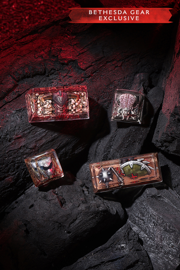Four decorative boxes with intricate designs on a dark stone surface, labeled 'Bethesda Gear Exclusive'.