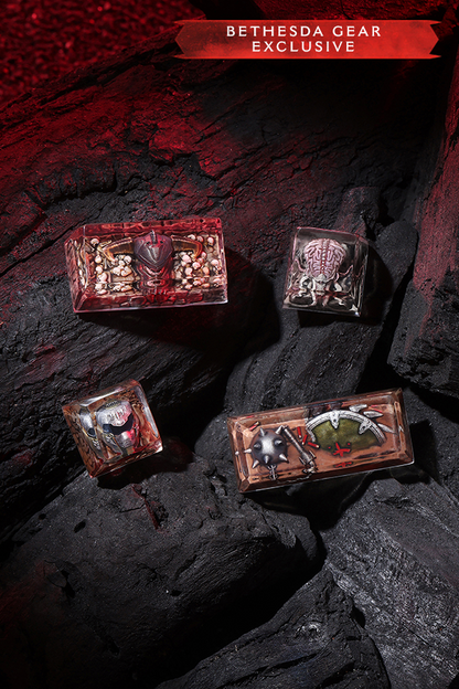 Four decorative boxes with intricate designs on a dark stone surface, labeled 'Bethesda Gear Exclusive'.