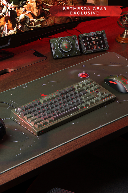 Gaming setup with keyboard, mouse, and monitor on a desk, featuring Bethesda Gear branding.