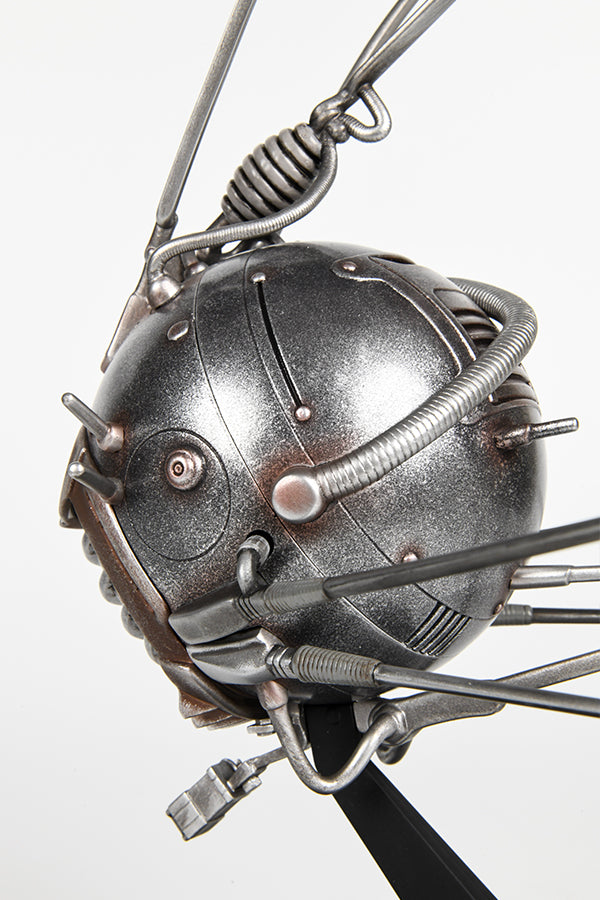 Detail view of the left side of the Fallout Eyebot statue