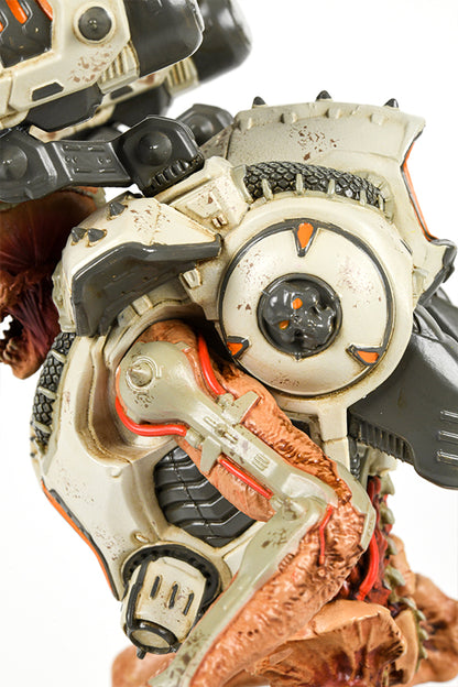 Close-up shot of the DOOM Eternal Revenant Statue, showing the details of the jetpack from the side. The design features a small gray skull with orange eyes.