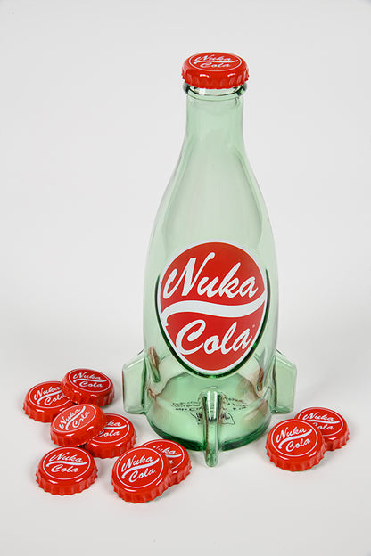 Image of an empty Fallout Nuka Cola Glass Bottle surrounded by caps 