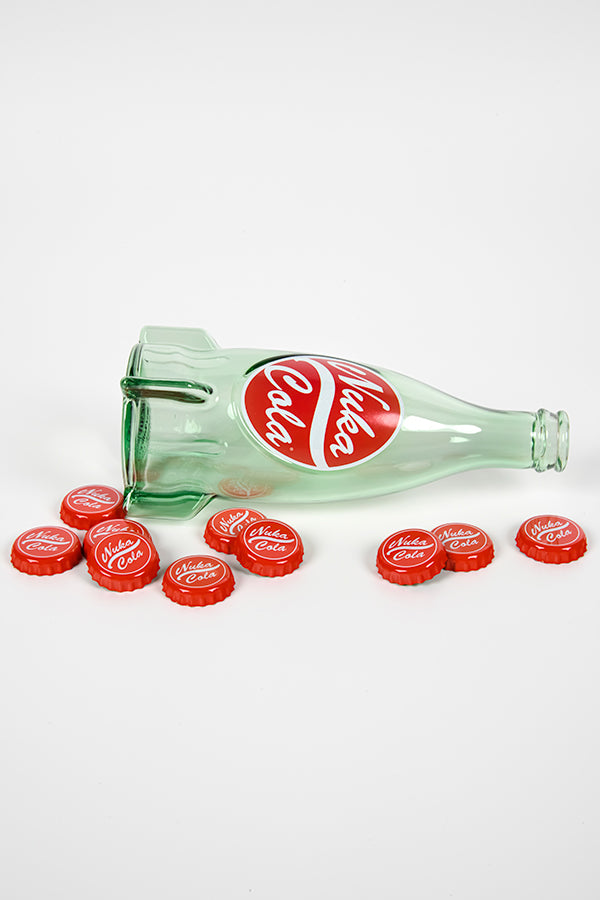 Image of the Fallout Nuka Cola Glass Bottle on its side surrounded by caps