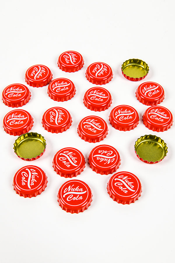 Image of the Nuka Cola Bottle Caps on a flat surface