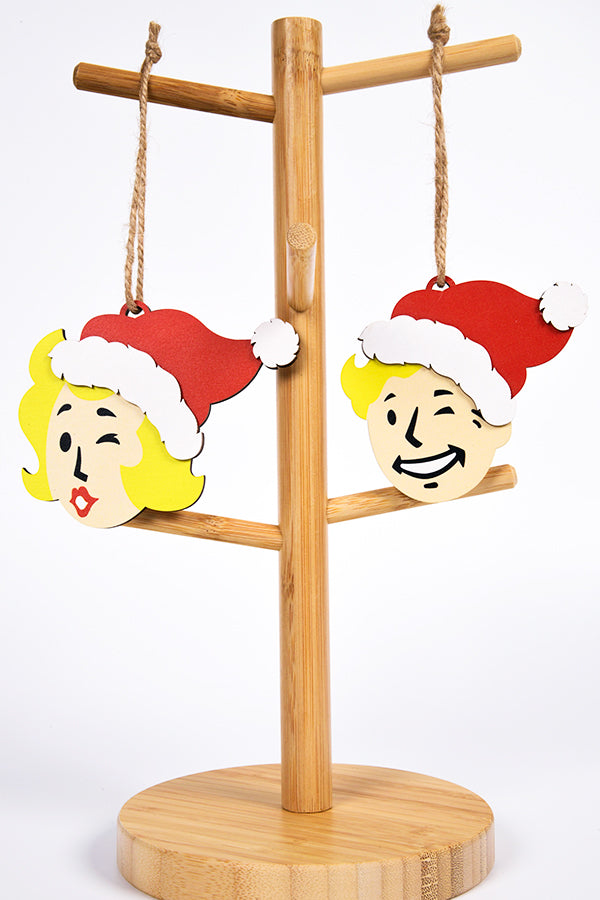 Image: Fallout Vault Boy and Girl Wooden Ornament Set on wooden stand